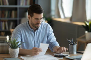 Man paying his AC Bill