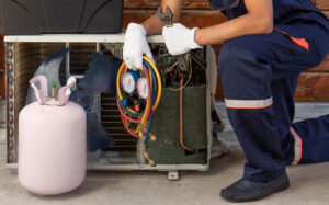 Hvac expert exchanging freon with mask